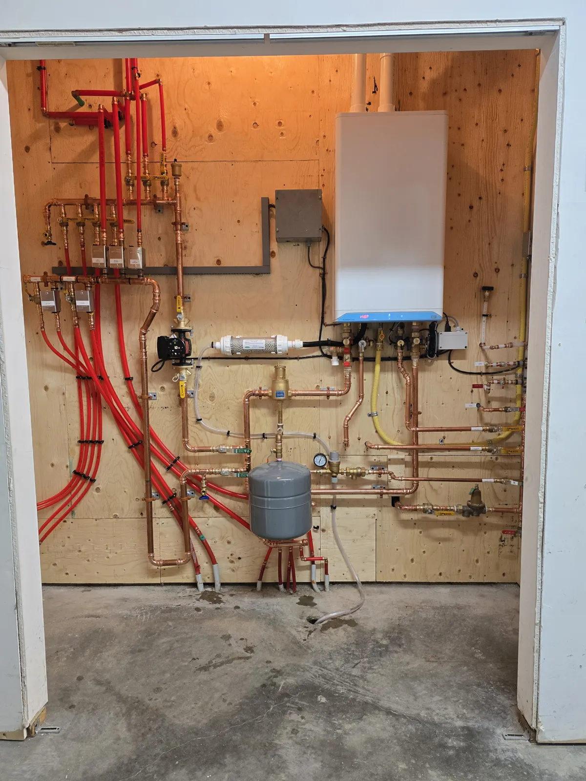 technician servicing a heat pump or boiler