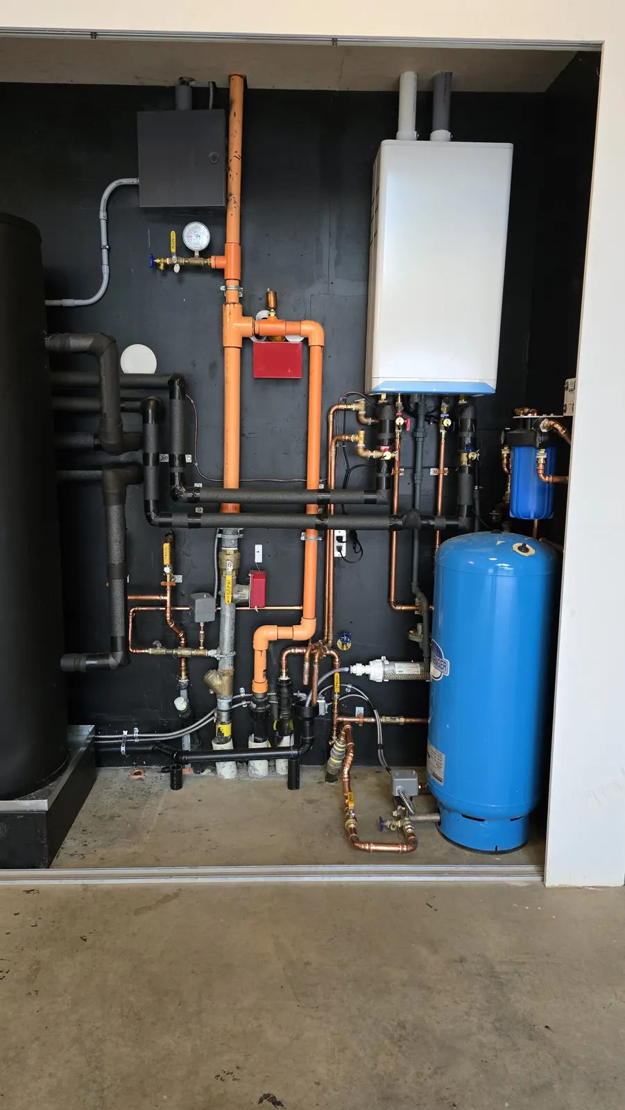 After: right side of the new wall with the IBC boiler and blue pressure tank