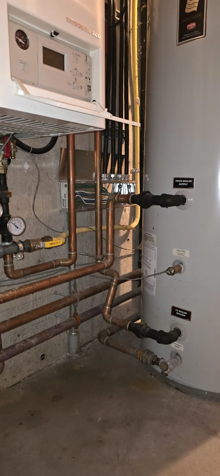 Before: Viessmann Vitodens boiler and tank beside the old piping